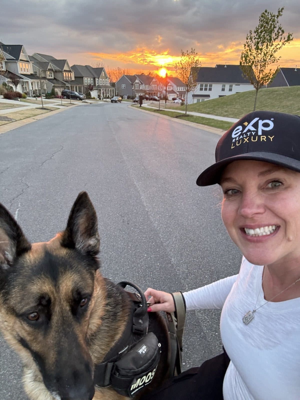 Amy Weaver and her dog Moose on a sunrise morning walk